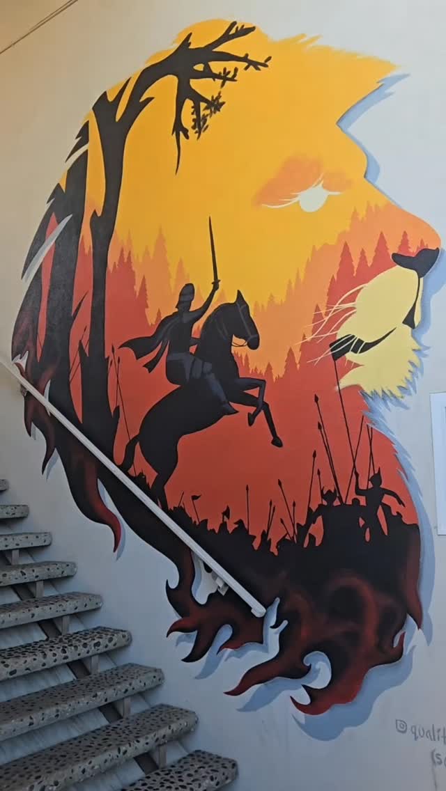 Lion head mural with a knight inside