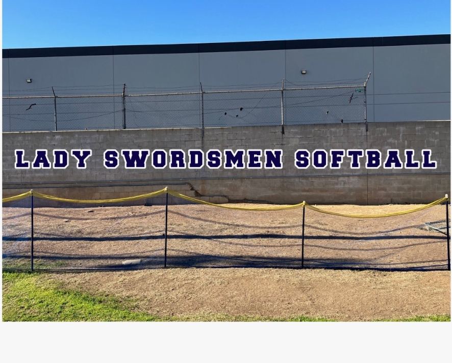 Lady Swordsmen Softball block lettering on a field wall