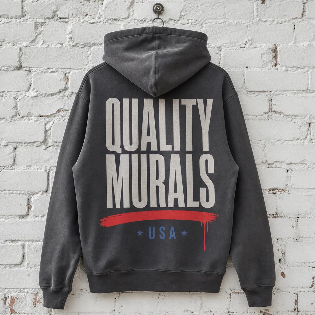 Quality Murals wordmark printed across the back of a grey hoodie